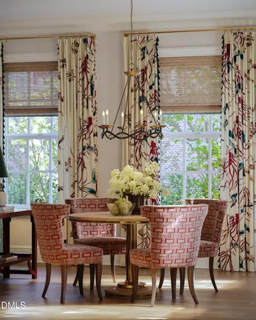 a dining room with furniture and window