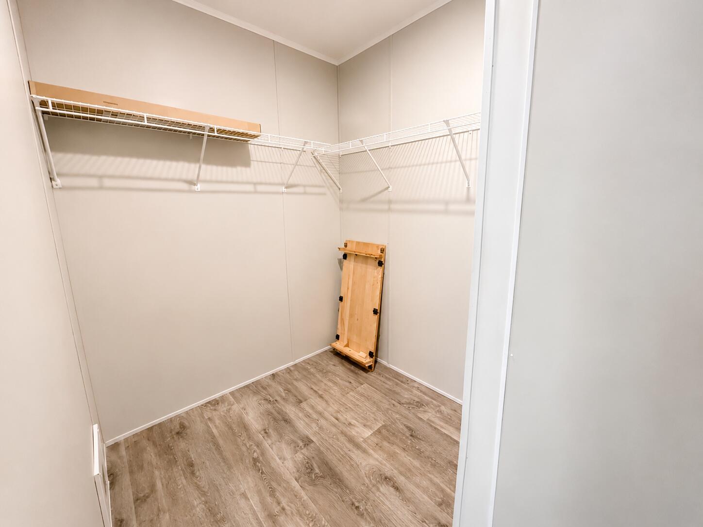 1121 Orange Loop Okeechobee, FL 34974 - Photo 23 of 33 Bright Empty Walk-In Closet with Wire Sh