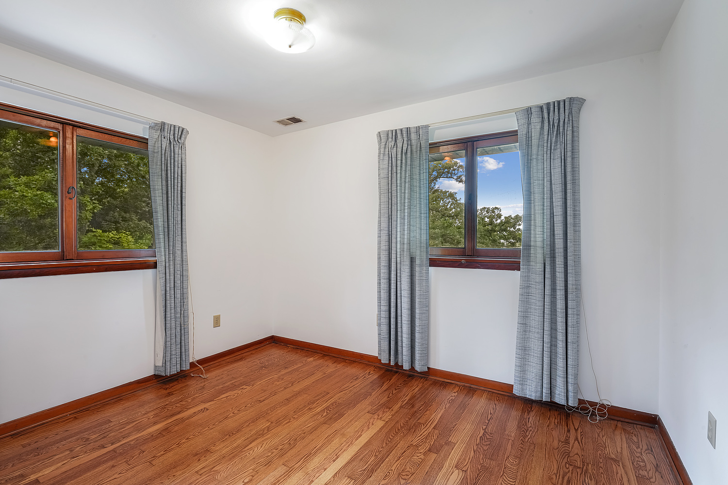 27960 South Klemme Road Beecher, IL 60401 - Photo 13 of 24 an empty room with wooden floor and windows