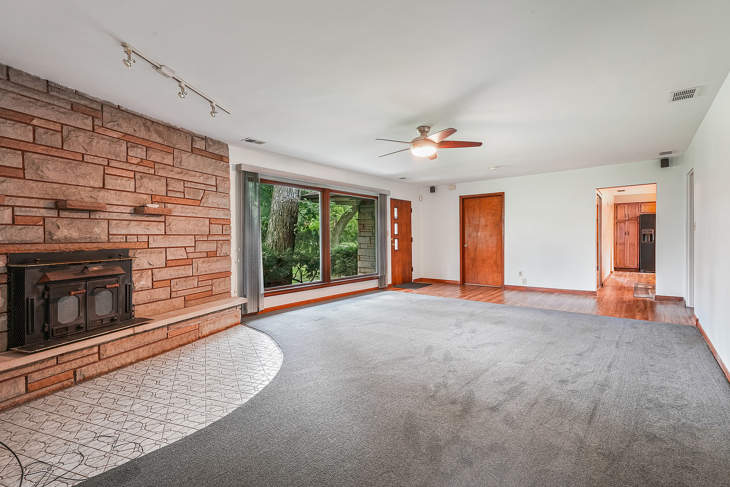 27960 South Klemme Road Beecher, IL 60401 - Photo 5 of 24 a view of an empty room with a fireplace and a window