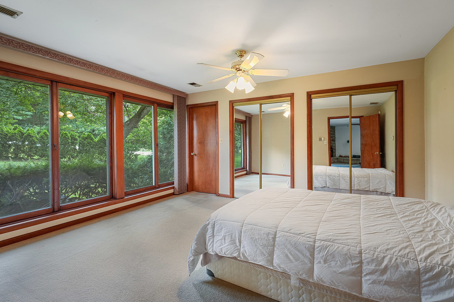 27960 South Klemme Road Beecher, IL 60401 - Photo 10 of 24 a bedroom with a large bed and a large window
