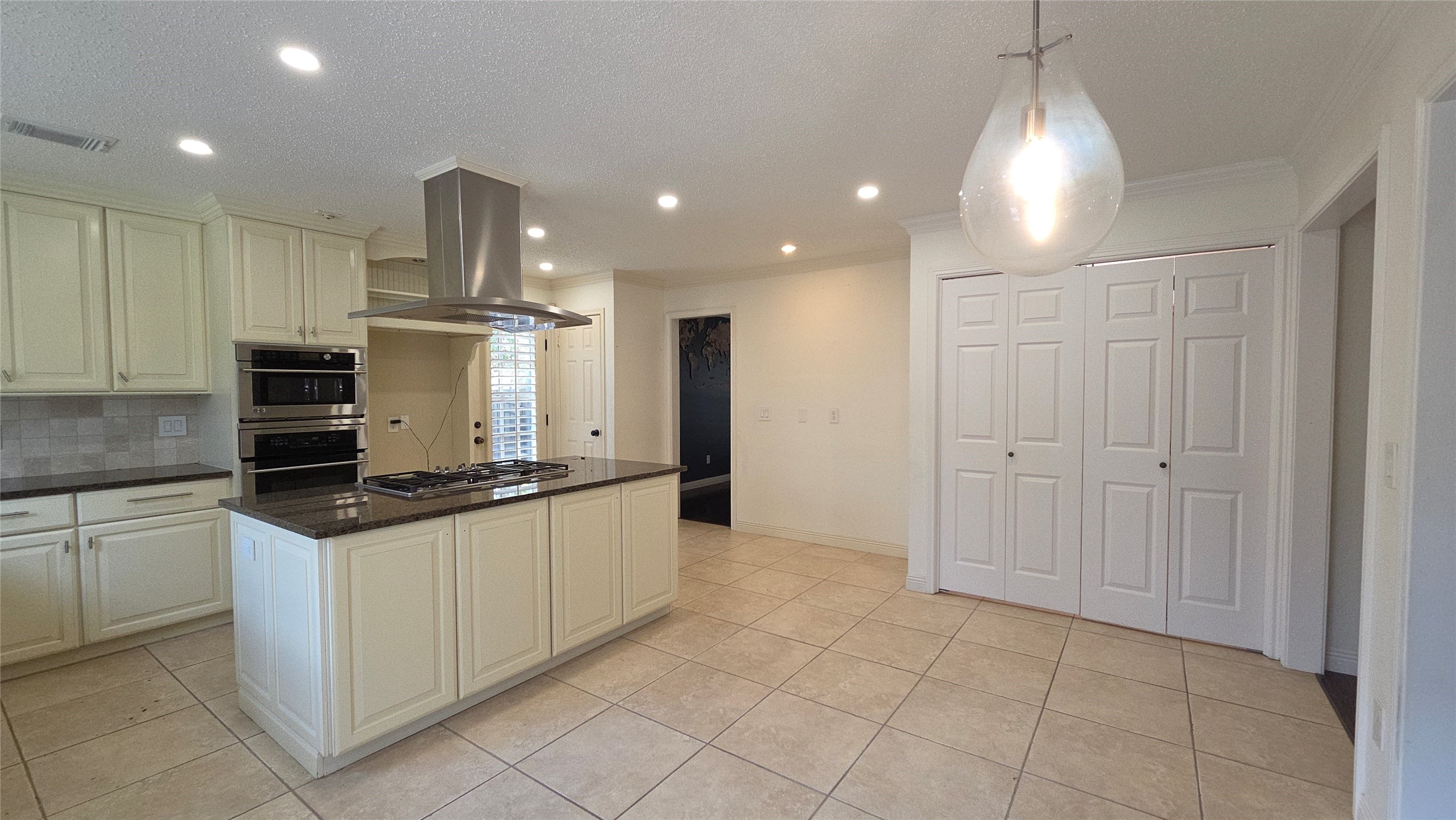 54 Thorn Berry Place Spring, TX 77381 - Photo 17 of 32 a kitchen with granite countertop a sink and white cabinets