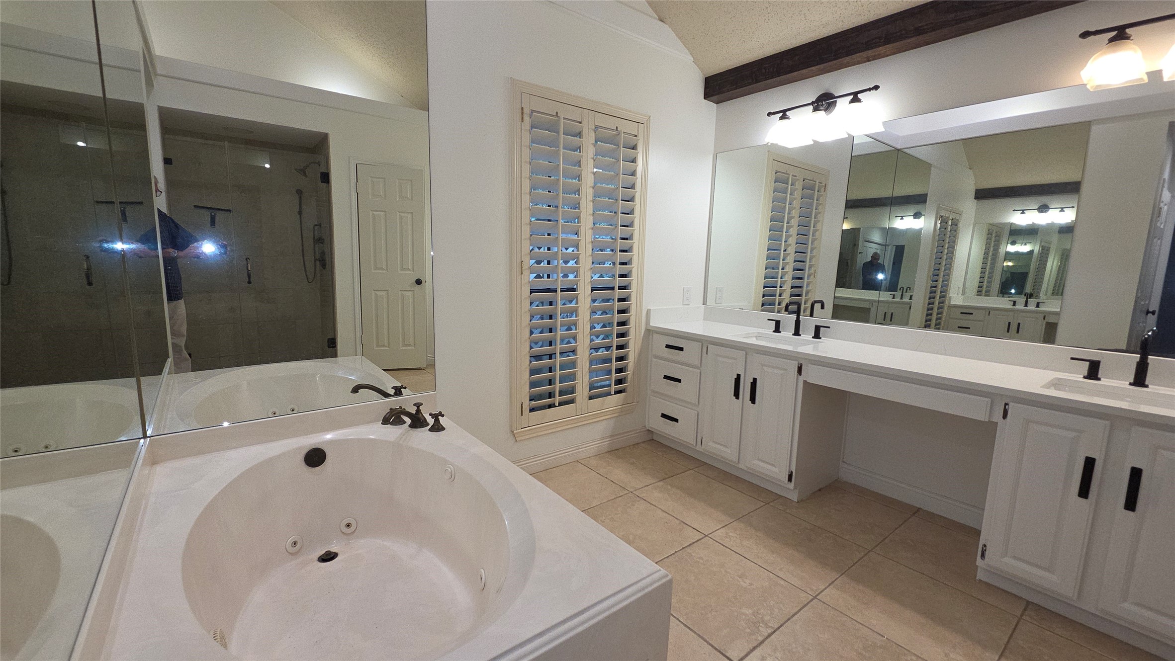 54 Thorn Berry Place Spring, TX 77381 - Photo 23 of 32 a bathroom with a tub sink and mirror