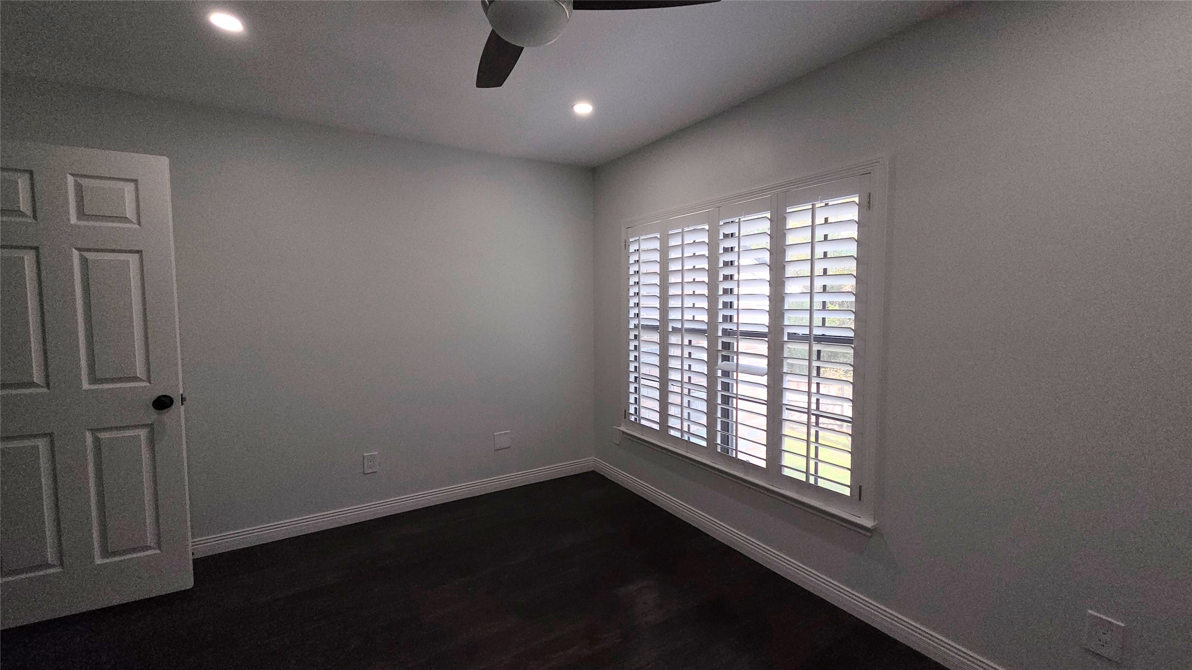 54 Thorn Berry Place Spring, TX 77381 - Photo 26 of 32 a view of an empty room with wooden floor and a window