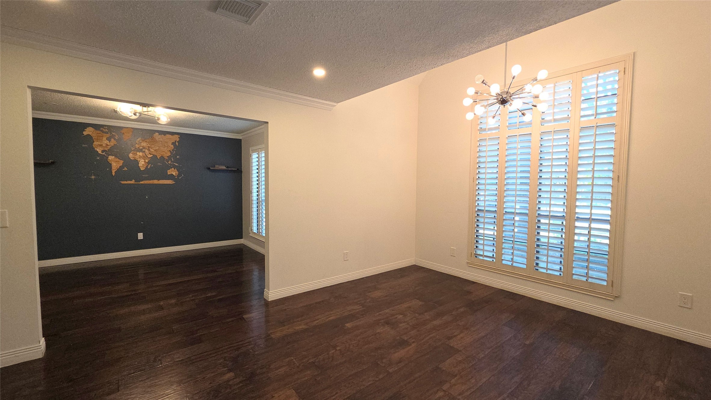 54 Thorn Berry Place Spring, TX 77381 - Photo 3 of 32 an empty room with wooden floor and windows