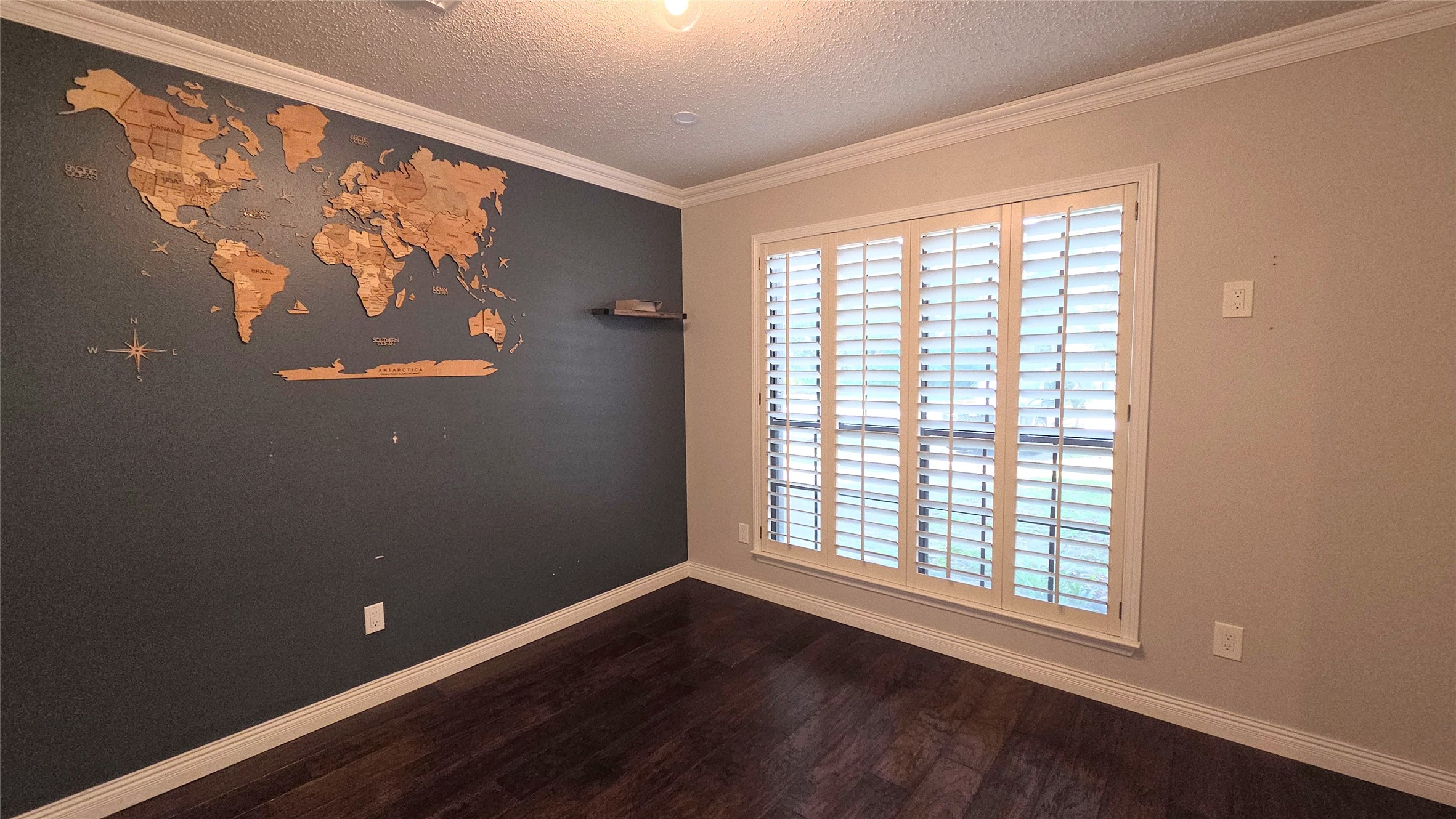54 Thorn Berry Place Spring, TX 77381 - Photo 7 of 32 a view of an empty room with wooden floor and a window
