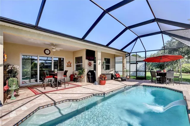 a view of a chairs and table in patio