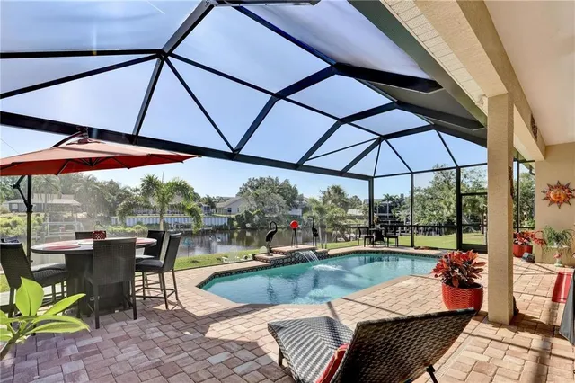 an outdoor space with patio furniture and umbrella