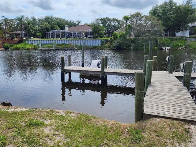 a view of a lake with a bench next to a lake