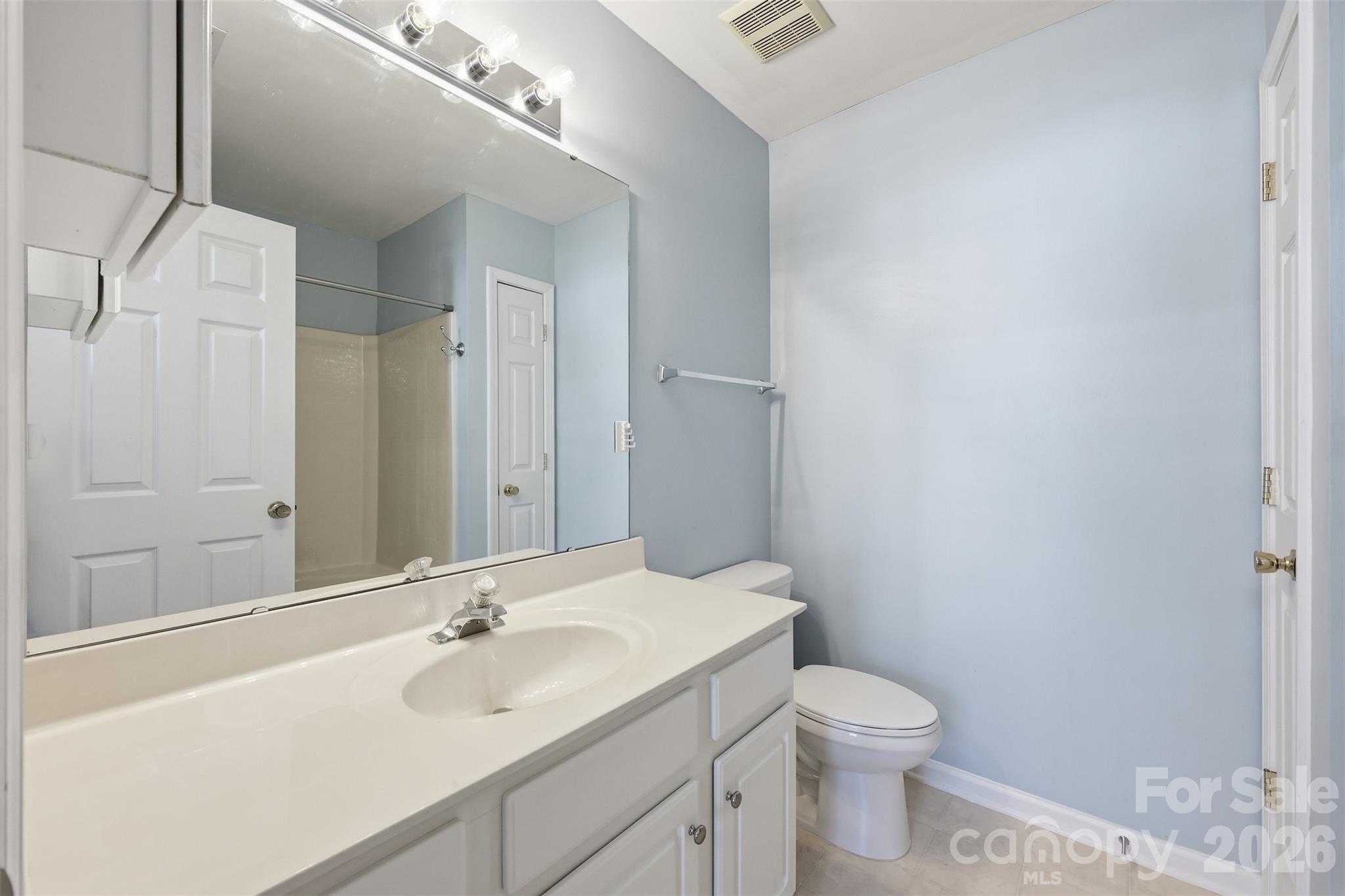 727 Shellstone Place Fort Mill, SC 29708 - Photo 17 of 31 a bathroom with a sink a toilet and shower