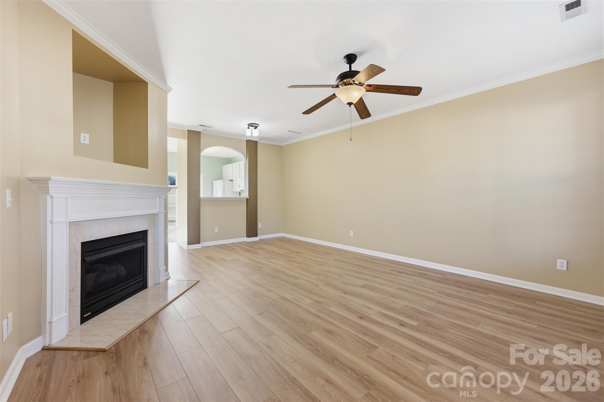 727 Shellstone Place Fort Mill, SC 29708 - Photo 2 of 31 a view of empty room with wooden floor and fireplace