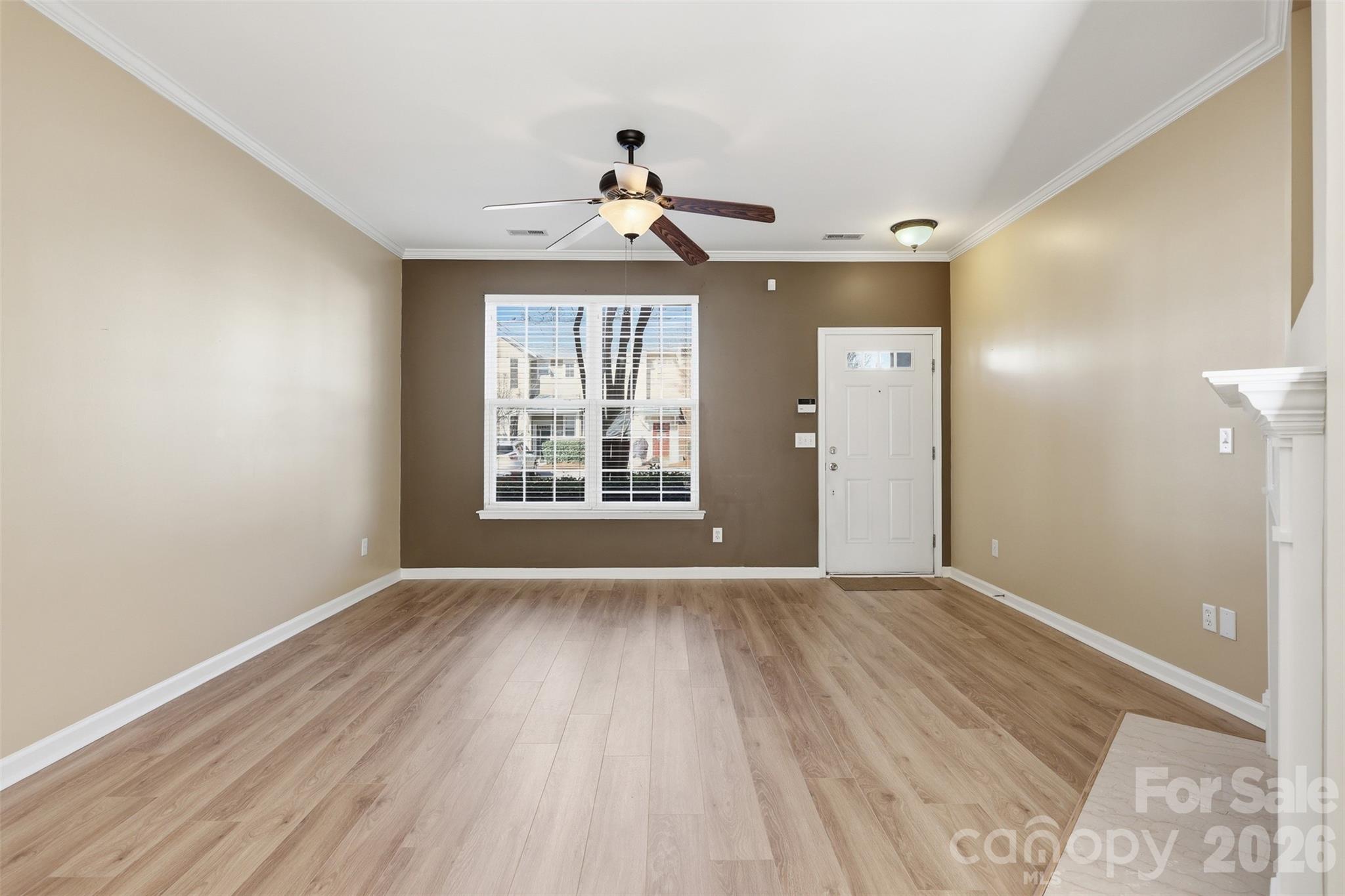 727 Shellstone Place Fort Mill, SC 29708 - Photo 6 of 31 a view of an empty room with wooden floor and a window
