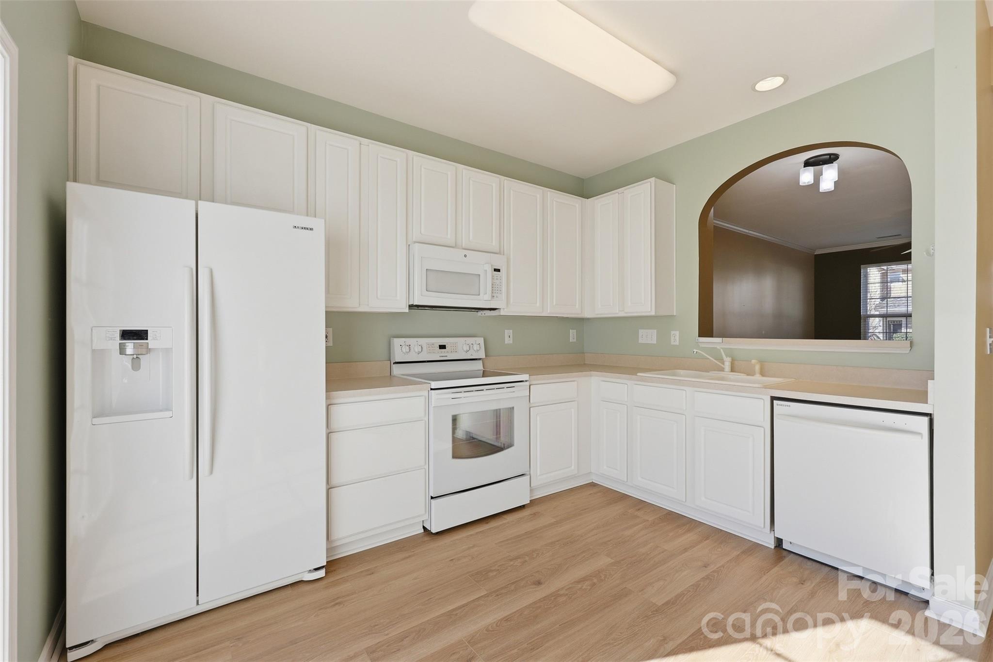 727 Shellstone Place Fort Mill, SC 29708 - Photo 8 of 31 a kitchen with cabinets oven and white appliances