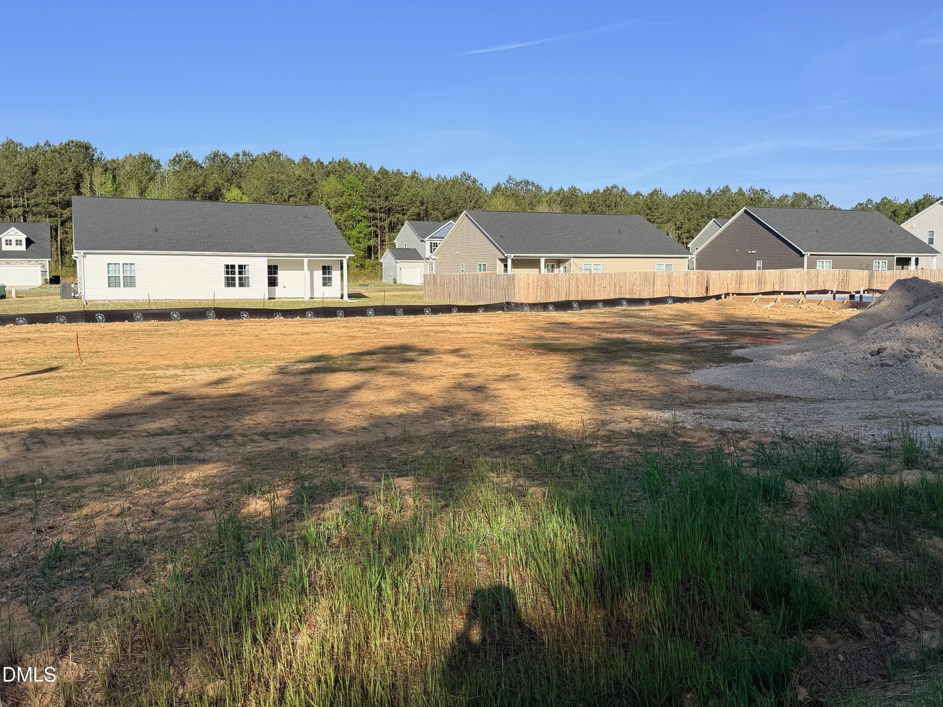 48 Loganberry Avenue Bunnlevel, NC 28323 - Photo 5 of 8 a view of a lake with houses in the back