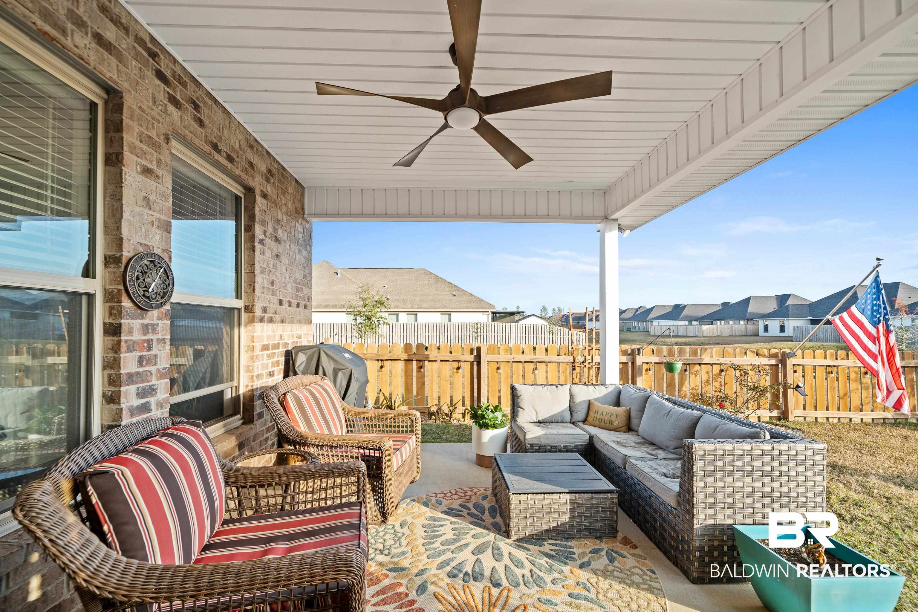 1390 Aldon Street Foley, AL 36535 - Photo 21 of 31 Fenced backyard featuring a ceiling fan, a patio area, an outdoor living space, and grilling area