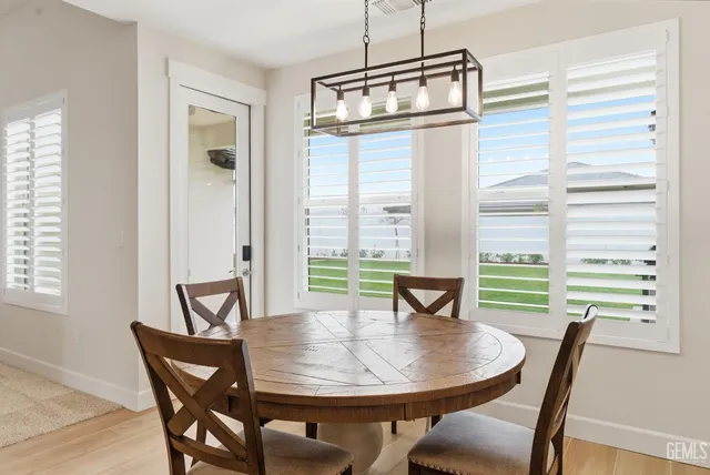 a view of a dining room with furniture window and outside view