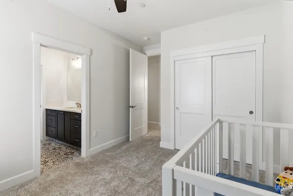 a view of an empty room with kitchen