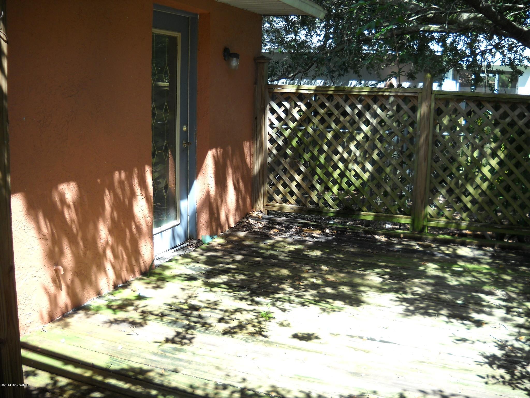 6498 Hunt Road Cocoa, FL 32927 - Photo 14 of 15 Wood decking in back yard