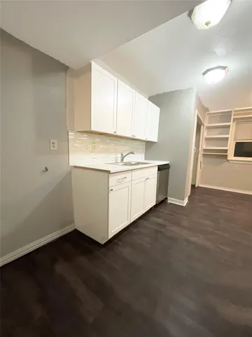 a view of a kitchen with a sink and dishwasher