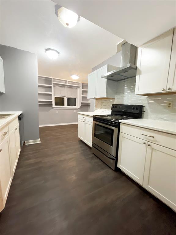 3924 Hunters Trail Mesquite, TX 75150 - Photo 13 of 23 a kitchen with stainless steel appliances granite countertop a stove sink and cabinets