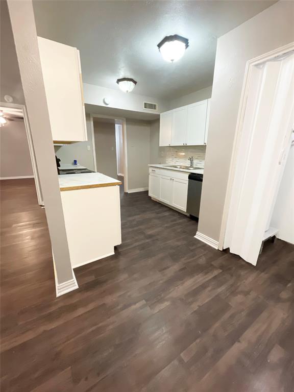 3924 Hunters Trail Mesquite, TX 75150 - Photo 14 of 23 a kitchen with sink a refrigerator and white stove top oven
