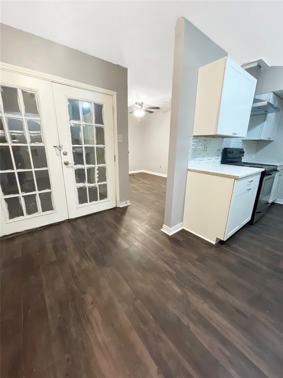 3924 Hunters Trail Mesquite, TX 75150 - Photo 15 of 23 an empty room with wooden floor and windows