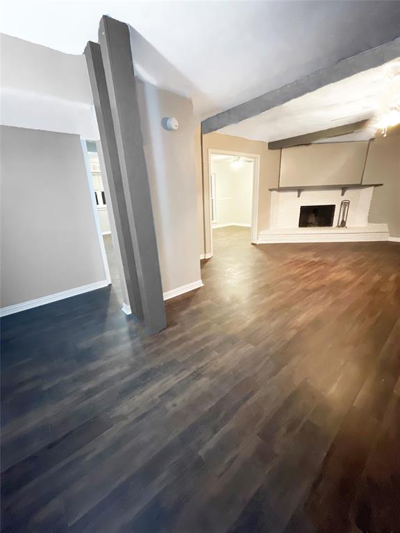 3924 Hunters Trail Mesquite, TX 75150 - Photo 3 of 23 an empty room with wooden floor and windows