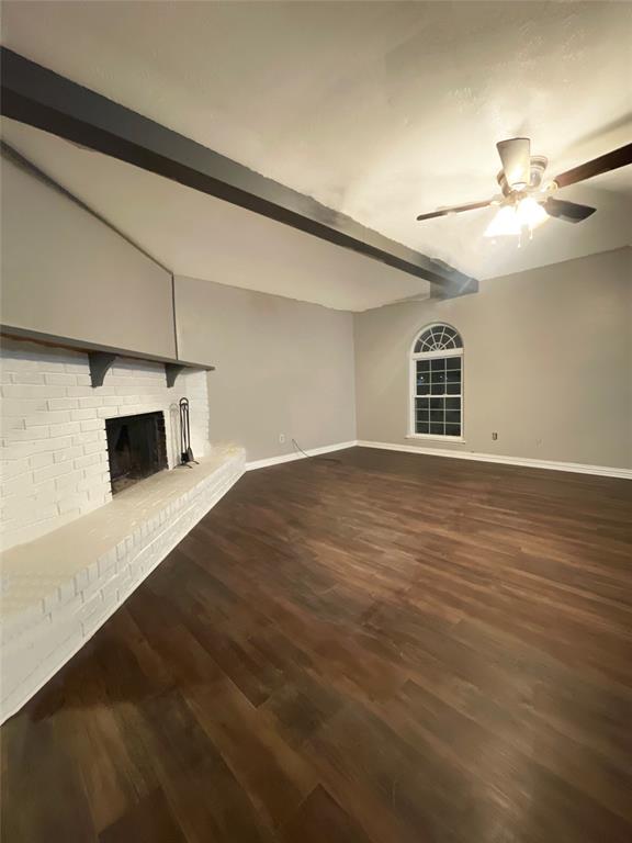 3924 Hunters Trail Mesquite, TX 75150 - Photo 6 of 23 a view of an empty room with window and wooden floor