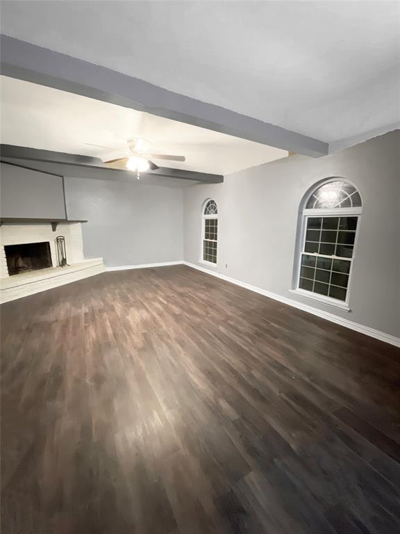 3924 Hunters Trail Mesquite, TX 75150 - Photo 7 of 23 a view of empty room with wooden floor and fireplace