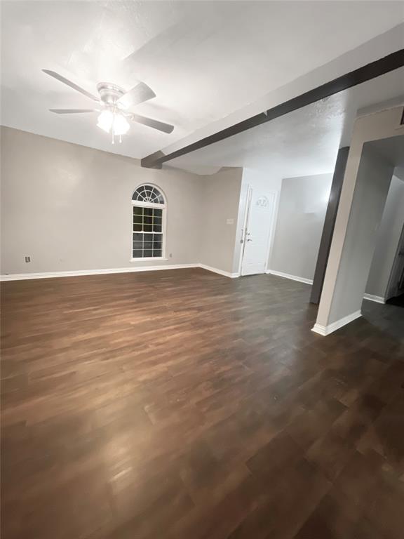 3924 Hunters Trail Mesquite, TX 75150 - Photo 8 of 23 a view of an empty room with wooden floor and a window