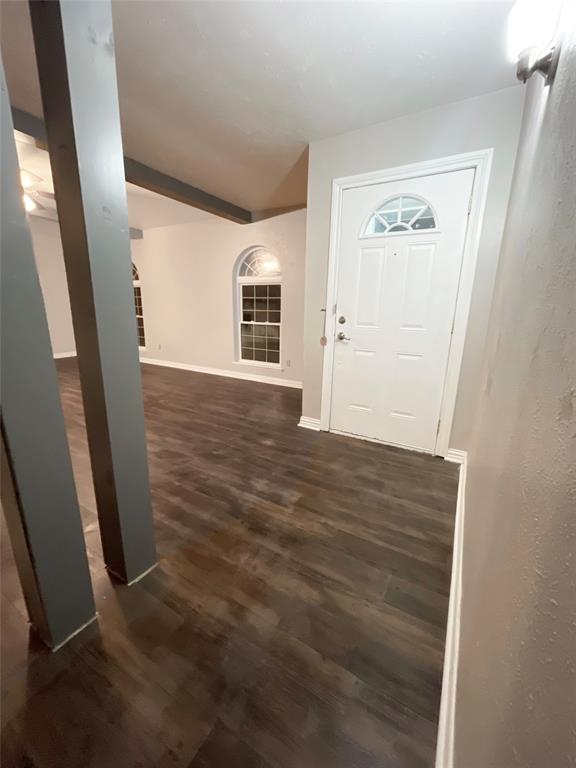 3924 Hunters Trail Mesquite, TX 75150 - Photo 10 of 23 a view of a hallway with wooden floor and staircase