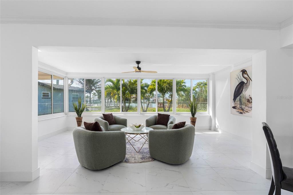 785 115th Avenue Treasure Island, FL 33706 - Photo 12 of 46 a living room with furniture and a large window