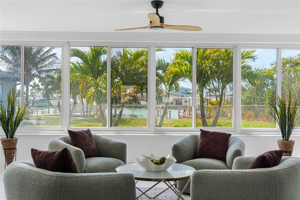 785 115th Avenue Treasure Island, FL 33706 - Photo 14 of 46 a living room with furniture and a large window