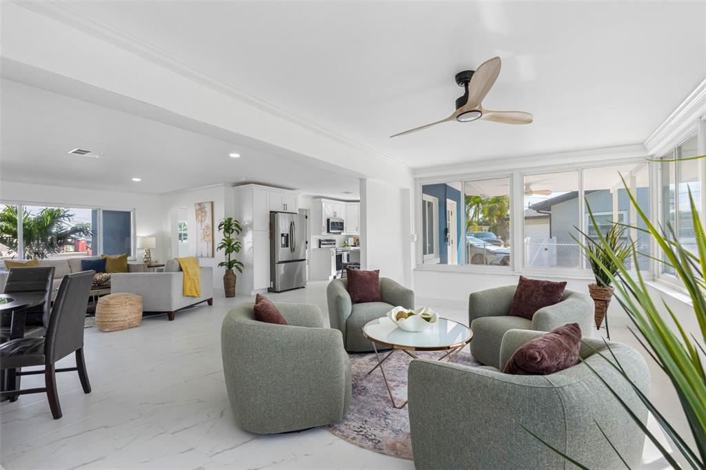 785 115th Avenue Treasure Island, FL 33706 - Photo 15 of 46 a living room with furniture and a large window