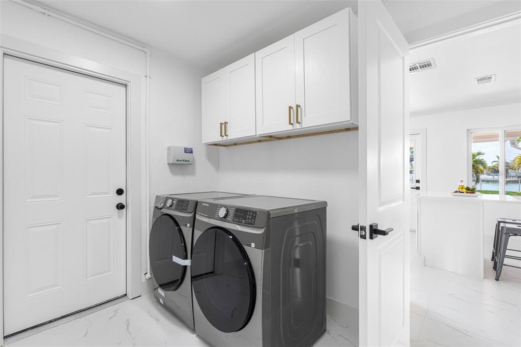 785 115th Avenue Treasure Island, FL 33706 - Photo 22 of 46 a utility room with dryer and washer