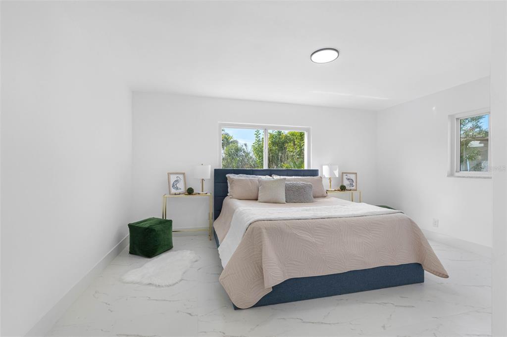 785 115th Avenue Treasure Island, FL 33706 - Photo 23 of 46 a bedroom with a bed and a window