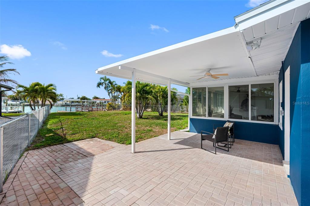 785 115th Avenue Treasure Island, FL 33706 - Photo 35 of 46 a view of a house with backyard porch and sitting area