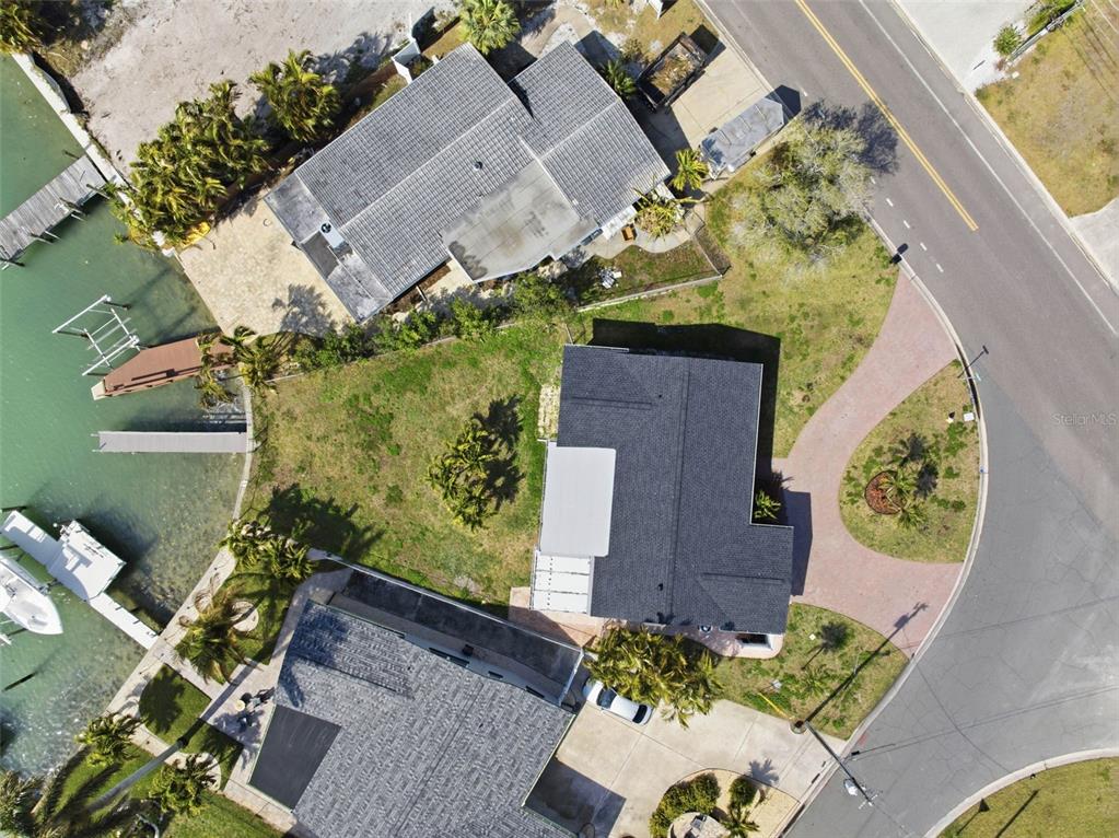 785 115th Avenue Treasure Island, FL 33706 - Photo 40 of 46 an aerial view of a house with a yard and garden