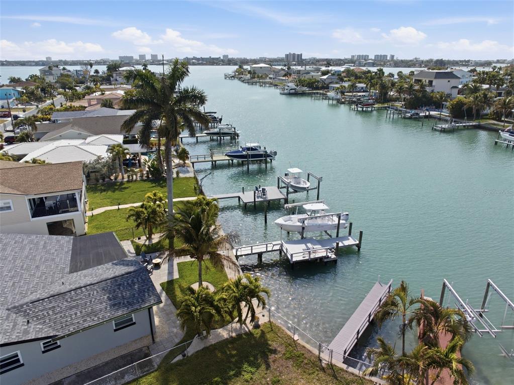 785 115th Avenue Treasure Island, FL 33706 - Photo 42 of 46 a view of a lake with a table and chairs