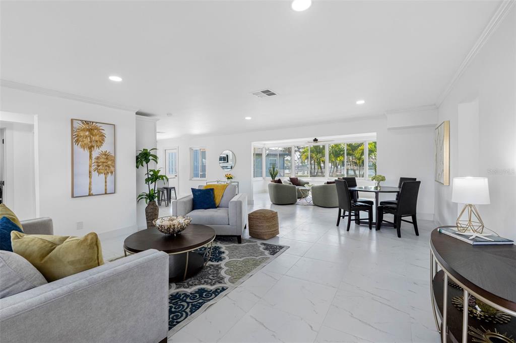 785 115th Avenue Treasure Island, FL 33706 - Photo 6 of 46 a living room with furniture and a large window