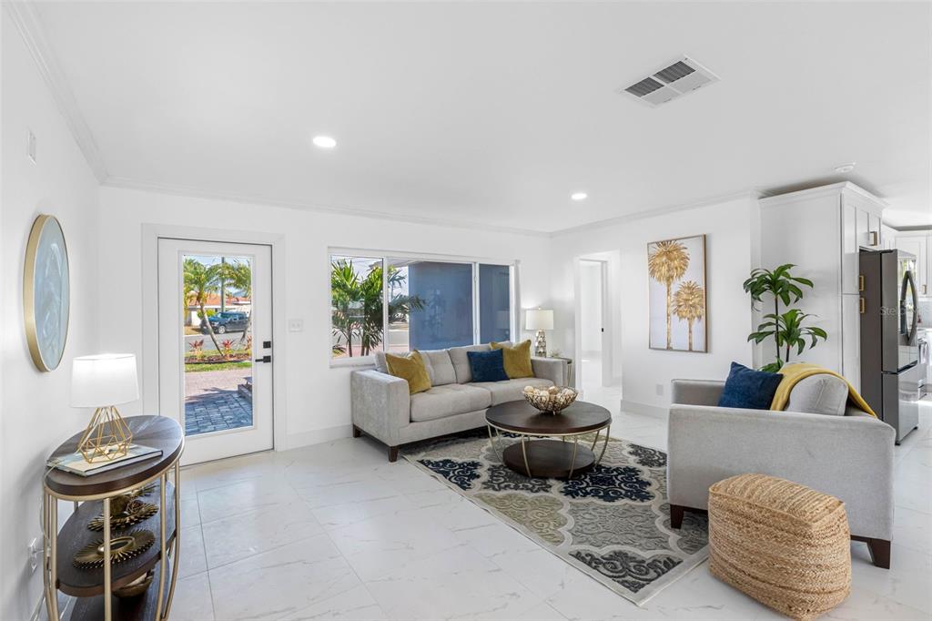 785 115th Avenue Treasure Island, FL 33706 - Photo 7 of 46 a living room with furniture and a couch