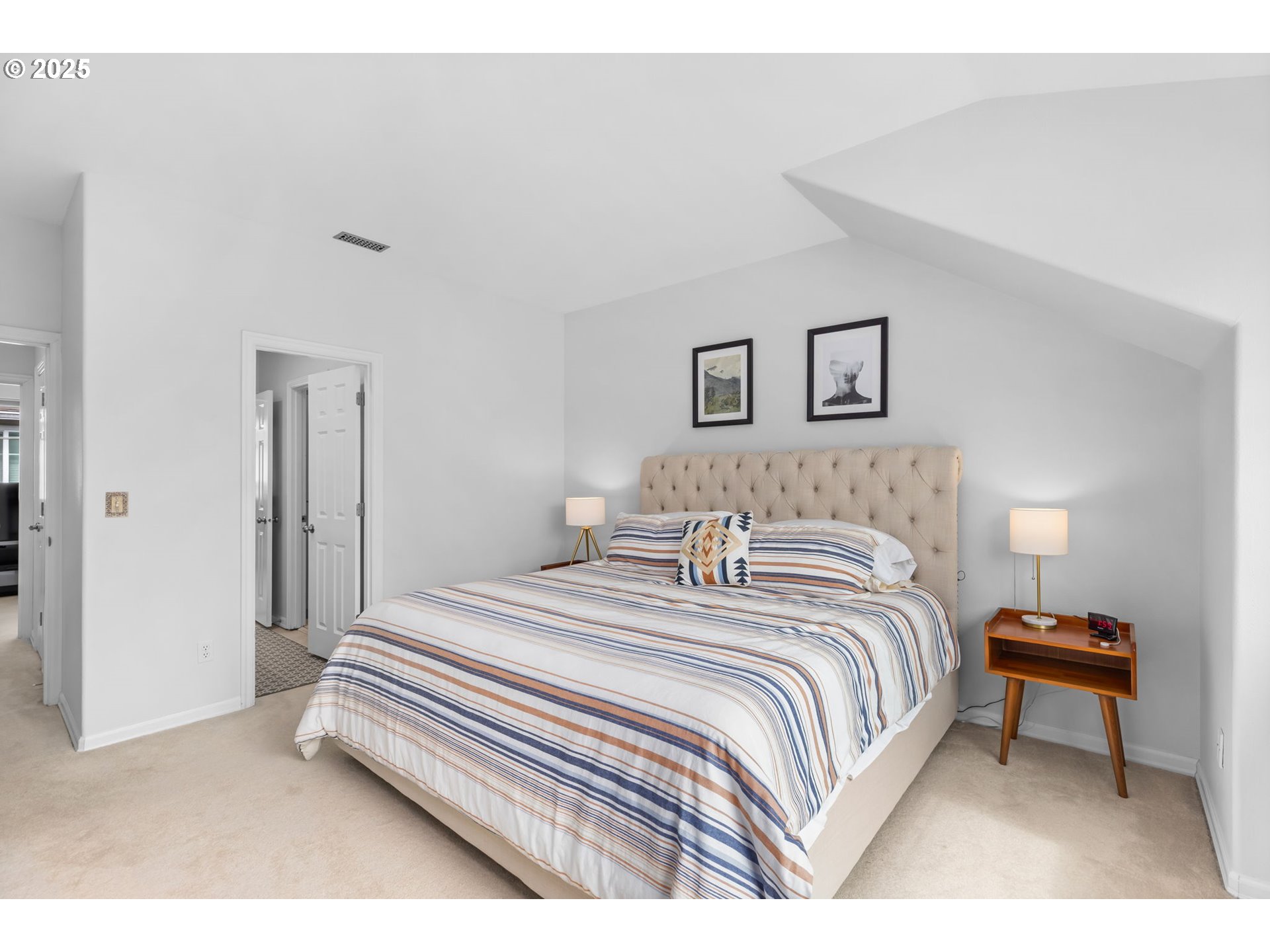 436 5th Street Lake Oswego, OR 97034 - Photo 18 of 35 a bedroom with a bed and a chandelier