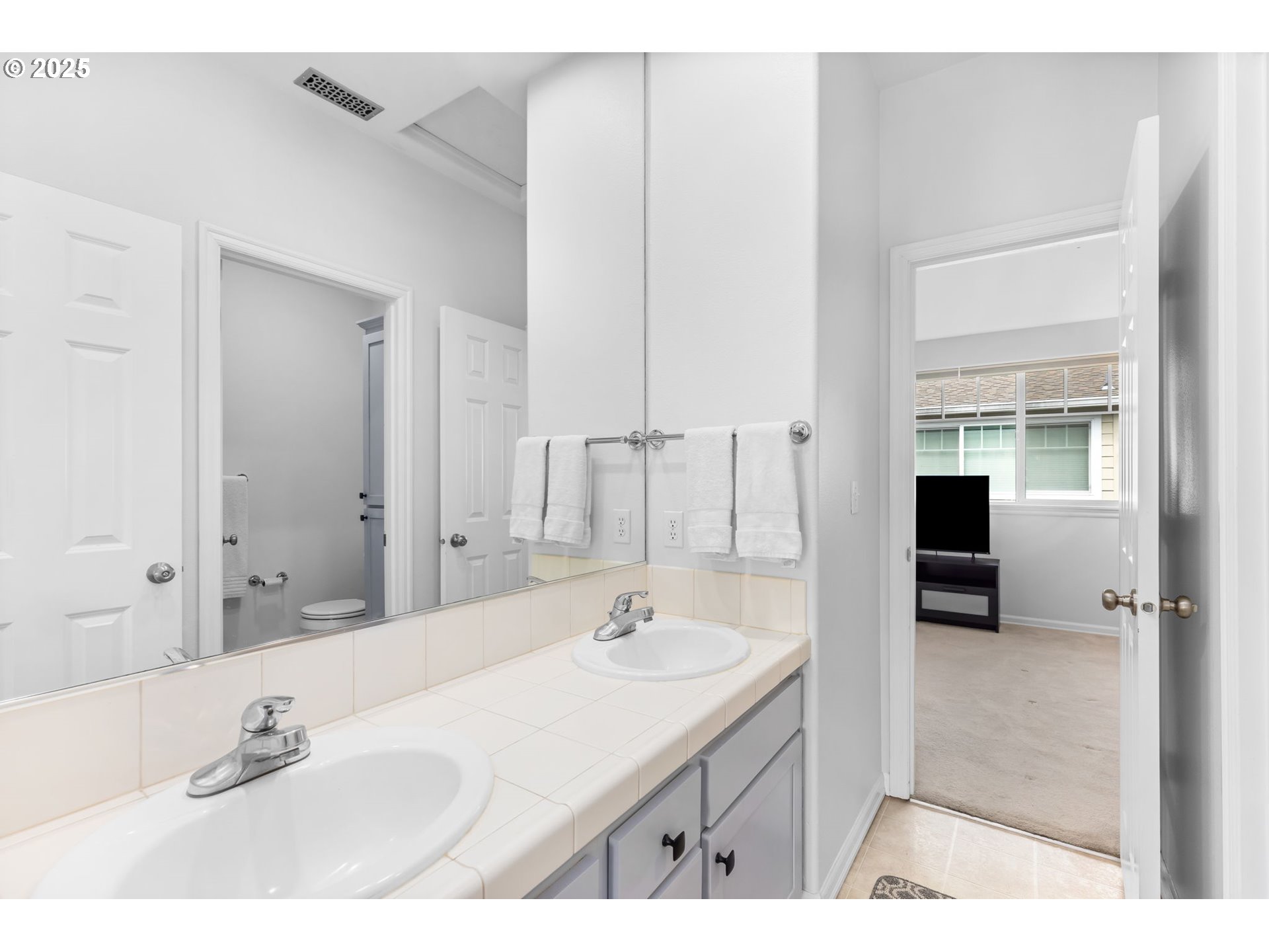 436 5th Street Lake Oswego, OR 97034 - Photo 26 of 35 a bathroom with a sink double vanity and a mirror