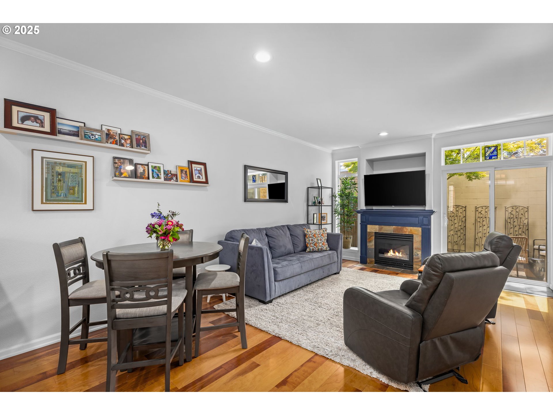 436 5th Street Lake Oswego, OR 97034 - Photo 5 of 35 a living room with furniture a flat screen tv and a fireplace