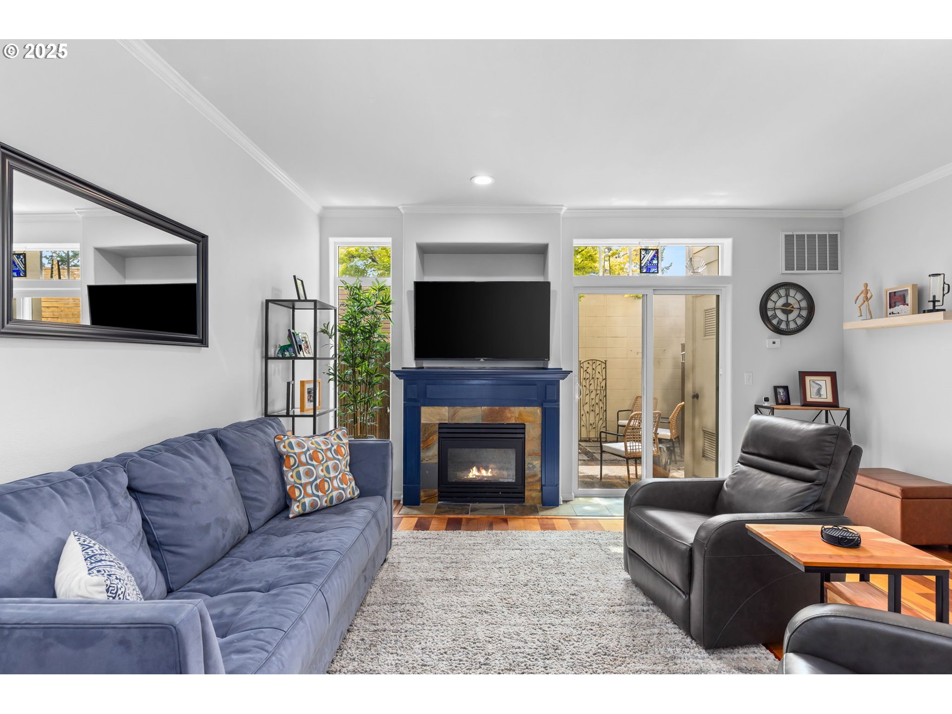 436 5th Street Lake Oswego, OR 97034 - Photo 6 of 35 a living room with furniture a flat screen tv and a fireplace