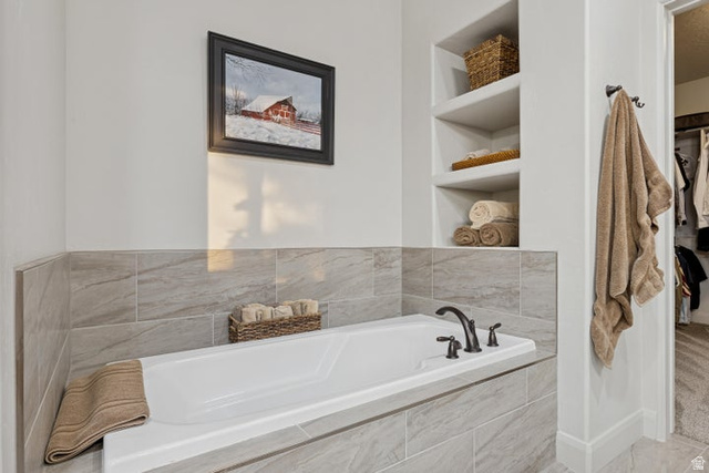 2925 Juniper Road Enterprise, UT 84725 - Photo 22 of 56 Bathroom featuring built in features, a garden tub, and a walk in closet