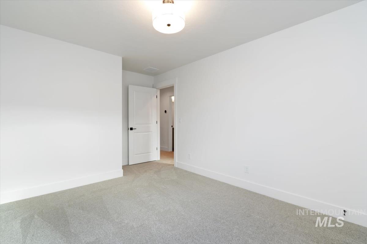736 South Calhoun Lane Star, ID 83669 - Photo 15 of 42 Carpeted spare room featuring baseboards