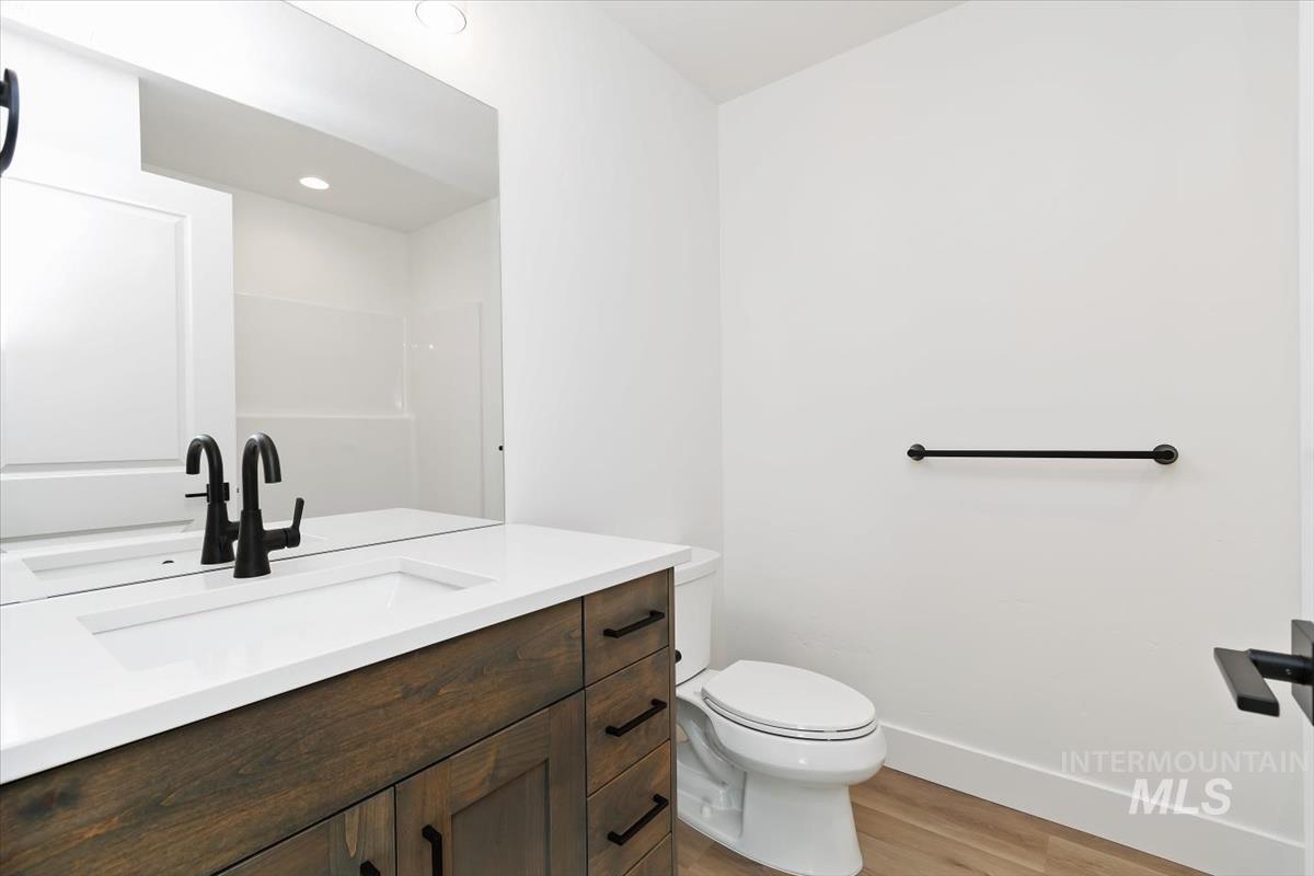 736 South Calhoun Lane Star, ID 83669 - Photo 18 of 42 Full bathroom with vanity, light wood-type flooring, and recessed lighting