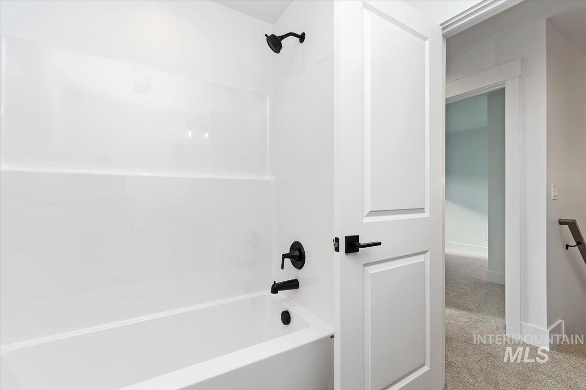 736 South Calhoun Lane Star, ID 83669 - Photo 20 of 42 Full bath with shower / bathtub combination and carpet flooring