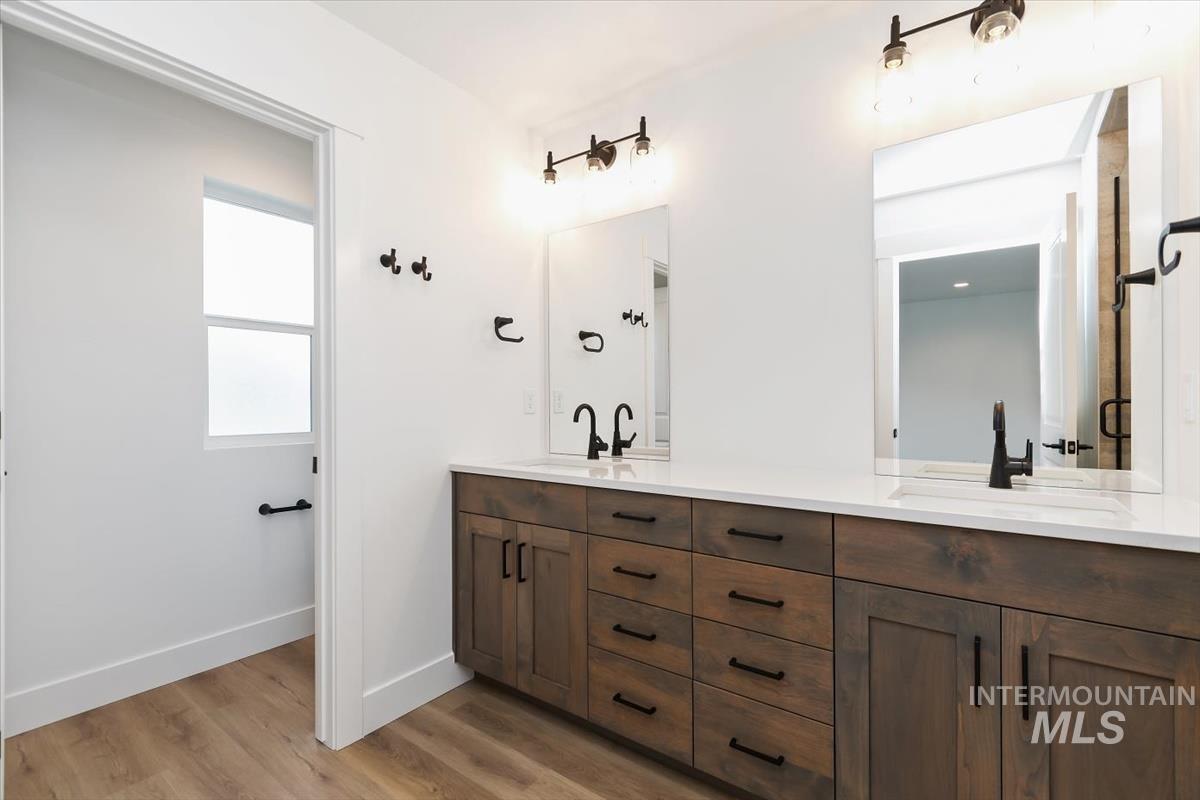 736 South Calhoun Lane Star, ID 83669 - Photo 25 of 42 Bathroom featuring double vanity and light wood-style flooring